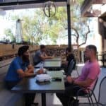 Carlsbad Ranch Market Patio seating surrounded by gabion wall & succulents