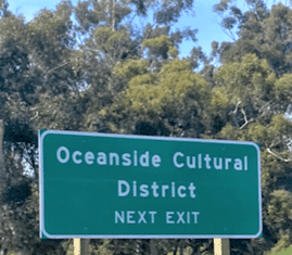 New Freeway Signs & Student Photography Banners Point to Oceanside Cultural District