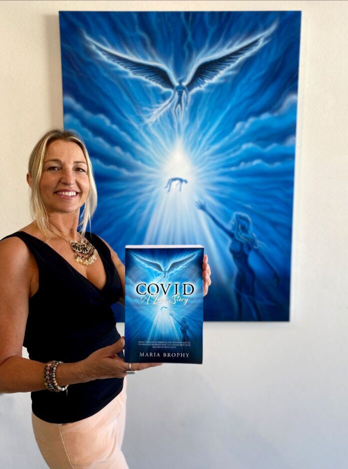 Maria Brophy holding book cover and art covid a love story memoir 2025